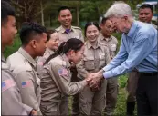  ?? LINH PHAM — THE NEW YORK TIMES ?? Chuck Searcy, an American veteran who co-founded Project Renew, a group that works to deactivate unexploded bombs, greets Trinh Thi Hong Tham, the leader of a demining team, last month in Dong Ha, in the Quang Tri province of Vietnam. Searcy lives in Hanoi.