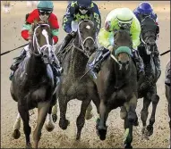  ?? Arkansas Democrat-Gazette/MITCHELL PE MASILUN ?? Conquest Mo Money (right), ridden by Jorge Carreno, finished second in the Arkansas Derby on April 15, but the colt might be in line for a big day in Saturday’s Preakness Stakes.