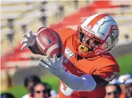  ?? JIM THOMPSON/JOURNAL FILE ?? UNM’s Elijah Lilly, making a TD catch vs. Sam Houston State in 2019, recently entered the transfer portal and was informed he would not be welcomed back to the program.