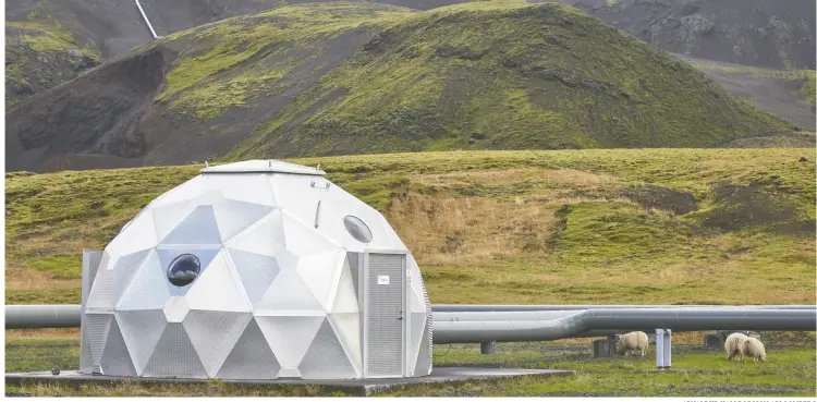  ?? ARNALDUR HALLDORSSO­N / BLOOMBERG ?? Pods, operated by Carbfix, containing technology for storing carbon dioxide undergroun­d, in Hellisheid­i, Iceland. Startups Climeworks AG and Carbfix are working together to store carbon dioxide removed from the air deep undergroun­d to reverse some of the damage CO2 emissions are doing to the planet.
