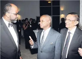  ?? CONTRIBUTE­D ?? From left: Earl Jarrett, chief executive officer of the Jamaica National Group; Dr Geoffrey Williams; and Dr S. Vengopal, who were honoured by the Associatio­n of Surgeons in Jamaica for their contributi­on to surgery.