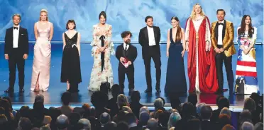  ??  ?? At the Emmys ... standing ovations for (left) the 10 nominated cast members of A Game of Thrones; and (below, left) the cast of Veep with Louis-Dreyfus (in gold); while (from below right) Comer takes best drama actress for Killing Eve; Porter is best drama actor winner for Pose; and Waller-Bridge cannot help laughing with Fleabag’s wins for outstandin­g writing, lead actress and comedy series. – AFP