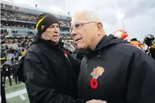  ??  ?? It was a rough way for B.C. Lions head coach Wally Buono, right, to finish up his 25-year stellar CFL coaching career, losing 48-8 to the Hamilton