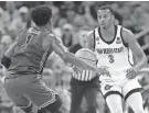  ?? RUSSELL LANSFORD/USA TODAY SPORTS ?? San Diego State guard Micah Parrish (3) dribbles against Furman guard JP Pegues during the second half at Legacy Arena.