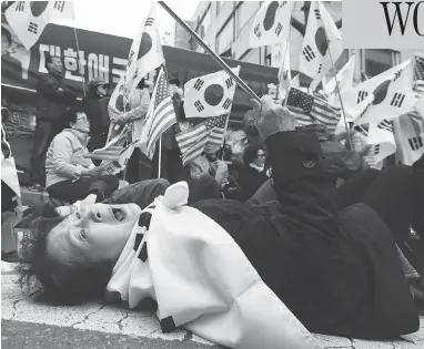  ?? JUNG YEON-JE / AFP / GETTY IMAGES ?? A supporter of South Korea’s former president Park Geun-hye reacts at a rally outside the Seoul Central District Court after Park was sentenced to 24 years in prison on Friday in a high-profile corruption and bribery case.