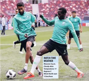  ??  ?? Saudi Arabia’s Salman Alfaraj (left) challenges for the ball with teammate Abdulmalek Alkhaibri at the official training session of the team on the eve of the opening match of the 2018 World Cup at Luzhniki stadium in Moscow, Russia, yesterday.