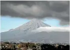  ?? SIMON O’CONNOR/STUFF ?? Conditions on Taranaki Maunga were relatively clear, though there was some cloud about the ranges.