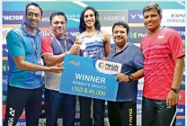  ??  ?? P.V. Sindhu (centre) poses with coaches Siddhath Jain (from left), Amrish Shinde, Sports analyst Md Maqdoom Ahmed and physio Johnson after winning the Korea Superserie­s on Sunday.