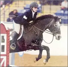  ?? COURTESY PHOTO ?? Sherrill Davis of Farmington competes in the national jumping equestrian competitio­n with Interschol­astic Equestrian Associatio­n. She finished in fifth place for the middle school division.