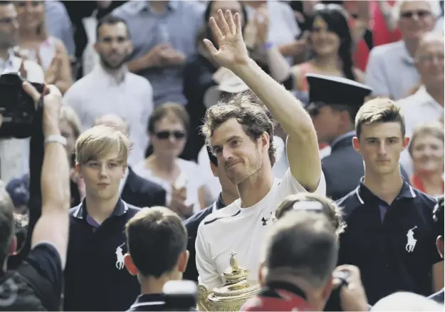  ??  ?? 0 Andy Murray, waving to the Wimbledon crowd after his straight-sets win over Milos Raonic, says the birth of his daughter, Sophia, has helped spur him to greater heights.