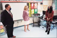  ?? Mandel Ngan/Pool via Associated Press ?? First lady Jill Biden and Education Secretary Miguel Cardona visit a classroom as they tour Benjamin Franklin Elementary School in Meriden on March 3.