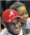  ?? ASSOCIATED PRESS FILE PHOTO ?? Alabama’s Rashaan Evans gets a big hug from his little sister, Ashley Evans. Evans was drafted by the Tennessee Titans in the first round Thursday night.