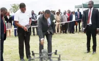  ?? - Picture: Thupeyo Muleya ?? Finance, Economic Developmen­t and Investment Promotion Minister, Professor Mthuli Ncube (centre) officially launches the Zimra drone monitoring project at Beitbridge Border Post yesterday. The multi-rotor drones which use infrared can scan an area of between 15km and 100km and can be flown at night or during bad weather.