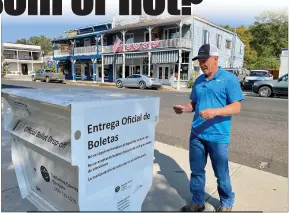  ?? Shelly Thorene / Union Democrat ?? Ray Emerald, of Jamestown (above), drops off his ballot on Main Street. He voted “yes” and said it was because of Governor Newsome’s failed policies and the level of corruption in Newsom’s family and added. Heather GallopCord­oza, of Sonora (left, at left), helps her father, Curtis Gallop, of Sonora, fill out his ballot at thetuolumn­e County Elections Office on Tuesday. Volunteers (below, from left) Dee Baumann, of Sonora, Debbie Bautista (registrar) and Leonides Maciel-russell, of East Sonora, sort ballots.