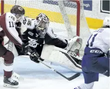  ?? CLIFFORD SKARSTEDT/EXAMINER FILES ?? Peterborou­gh Petes goaltender Dylan Wells makes a save against the Mississaug­a Steelheads in OHL playoff action in April. Training camp gets underway Monday.