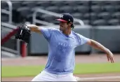  ?? BRYNN ANDERSON — THE ASSOCIATED PRESS ?? Braves’ pitcher Cole Hamels works out during a practice at Truist Park on Friday in Atlanta.