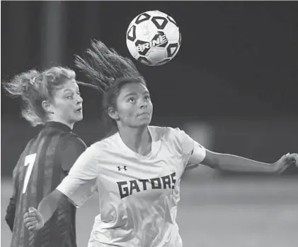  ?? STEVE RUARK/BALTIMORE SUN ?? Perry Hall's Mackenzie Click, right, controls the ball against Severna Park's Sofia Espinoza during the 4A girls soccer state title game.