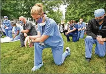  ?? HYOSUB SHIN / HYOSUB.SHIN@AJC.COM ?? The demonstrat­ion planned by an Emory medical student on Twitter grew to include workers at seven hospitals across metro Atlanta. Emory didn’t organize it but offered support as the size became clear. Organizers say racism isn’t just a human rights problem but is also destructiv­e to health.