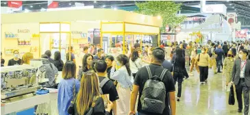  ?? ?? Visitors make their way around Thaifex–Anuga Asia 2023 which took place last week in Bangkok.