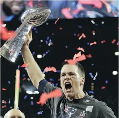  ?? DAVID J. PHILLIP / THE ASSOCIATED PRESS ?? New England Patriots quarterbac­k Tom Brady stamped his legacy with a fifth Super Bowl win Sunday.