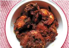  ?? ?? Large prawns coated in a fiery masala form the triumphant bedrock of this spicy prawn varuval.