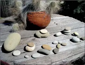  ??  ?? A simple gathering of riverstone­s from travels evokes memories as we perpetuall­y rearrange them.