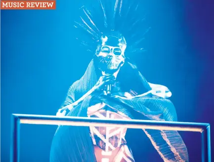  ?? Franchon Smith / The Chronicle ?? Grace Jones opens her concert in a silver skull mask with feathers, plus white body paint, at the Fox Theater in Oakland.