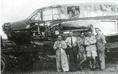  ?? Picture: DR M ERASMUS ?? BURNT OUT: Mechanics and fitters with a burnt-out AvroAnson after it crashed near Kasouga. Date unknown.