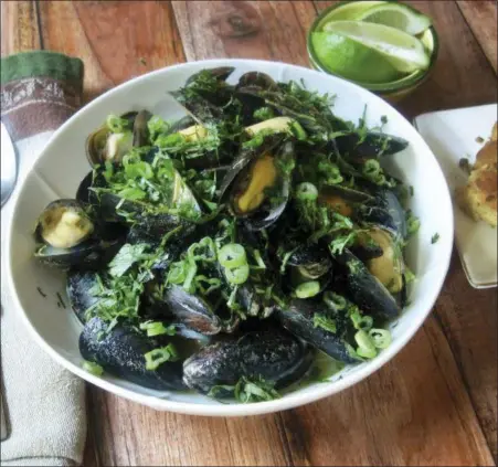  ?? PHOTO BY SARA MOULTON VIA AP ?? This February 2018photo shows steamed mussels with Thai flavoring in New York. This dish is froma recipe by Sara Moulton.