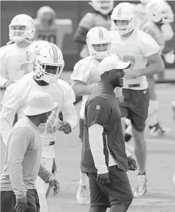  ?? LYNNE SLADKY/AP ?? Dolphins coach Brian Flores, center, will have the burden of rebuilding sitting squarely on him on a day-to-day basis this fall.