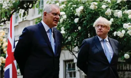  ?? Photograph: Luke Macgregor/EPA ?? Australian prime minister Scott Morrison and his British counterpar­t Boris Johnson have reached an in-principle free trade agreement, but back home, the ACTU is concerned about the impact on local workers.
