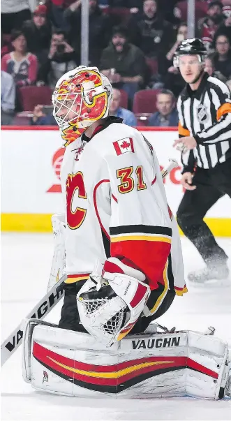  ?? MINAS PANAGIOTAK­IS/GETTY IMAGES/FILES ?? It was a game to forget back on Jan. 24 for goaltender Chad Johnson and the Flames as they lost 5-1 to the Canadiens at the Bell Centre.