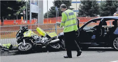  ?? TONY HARRISON ?? Reader Tony Harrison sent us this photograph of the police motorcycle immediatel­y after the accident outside Farnboroug­h Airshow on Sunday.