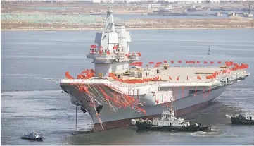  ??  ?? The type 001A, is seen during a launch ceremony at Dalian shipyard in Dalian, northeast China’s Liaoning Province. — AFP photo