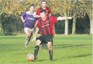  ??  ?? Paul
Right: Warragul United defender Oscar Sceney controls the ball during the 3-0 win over Mooroolbar­k.
The win moved Warragul United to fifth on the state league 1 ladder ahead of a clash with second-placed Manningham United Blues