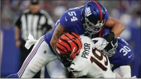  ?? (AP/Julia Nikhinson) ?? New York Giants linebacker Blake Martinez (top) tackles Cincinnati wide receiver Kendrick Pryor during the Giants’ 25-22 exhibition victory last month in East Rutherford, N.J. Martinez, who led the team in tackles in 2020, was released Thursday.