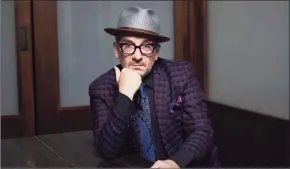  ?? Matt Licari / Associated Press ?? Elvis Costello's new album, the coronaviru­s-era disc “The Boy Named If” was made in solitary style — four musicians — all worked from their own homes.