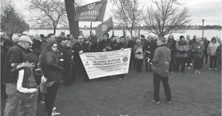  ?? DALSON CHEN ?? Brian Hogan, president of the Windsor & District Labour Council, addresses the crowd gathered at the workers’ monument in Windsor’s Coventry Gardens. The ceremony was part of the council’s annual observance of the national Day of Mourning for workers...