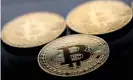  ??  ?? Gold-plated souvenir bitcoin coins. The cryptocurr­ency’s value rose past $10,000 this week. Photograph: Justin Tallis/AFP/Getty Images