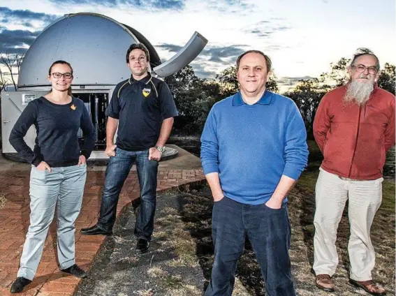  ?? Photo: ?? NEW FRONTIERS: Outside the telescope facility on Mt Kent are (from left) USQ researcher­s Belinda Nicholson, Jonathan Horner, Prof Brad Carter and Dr Rhodes Hart.