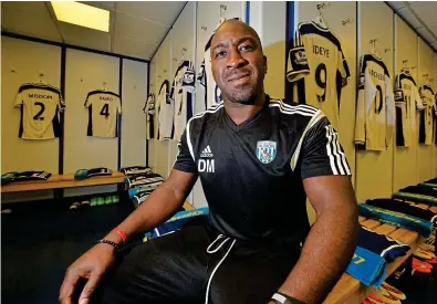  ??  ?? THE RIGHT MAN: Darren Moore of West Bromwich Albion in the dressing room ahead of his first game in charge