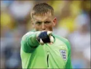  ?? FRANCISCO SECO — THE ASSOCIATED PRESS ?? England goalkeeper Jordan Pickford gestures during the quarterfin­al match between Sweden and England at the 2018 soccer World Cup in the Samara Arena, in Samara, Russia, Saturday.