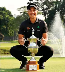  ?? — AFP photo ?? Boonma holding the winner’s trophy after round four of the Bangabandh­u Cup Bangladesh Open at the Kurmitola Golf Club in Dhaka.