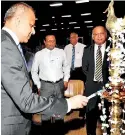  ??  ?? Ports and Shipping and Southern Developmen­t Minister Sagala Ratnayaka lighting the oil lamp