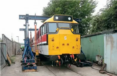  ?? ?? Now returned to action on the Chinnor and Princes Risborough Railway, 31163 (running as 97205) recently underwent fitting of a replacemen­t traction motor. On August 19, the locomotive is seen lifted off its bogies, while the traction motor was swapped out. Phil Marsh