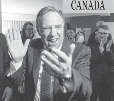  ?? RYAN REMIORZ/THE CANADIAN PRESS ?? Coalition Avenir Quebec premier-elect Francois Legault celebrates with supporters in Quebec City Monday night after winning a majority in the provincial election, the first time a third party has taken power in decades.