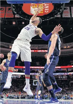  ?? AP ?? The 76ers’ Ben Simmons, left, dunks against the Mavericks.