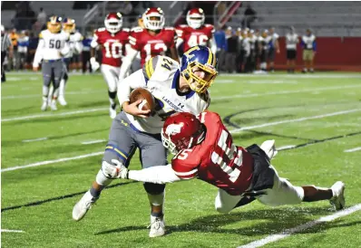  ?? Photo by Kevin Sutton ?? ■ Arkansas High defensive back Jalen Pastchol (15) tries to trip up Lakeside rusher William Perrigo (24) Friday at Razorback Stadium.