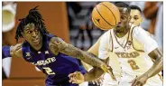  ?? NICK WAGNER / AMERICAN-STATESMAN ?? Kansas State guard Cartier Diarra and Texas guard Matt Coleman pursue a loose ball in Wednesday’s lackluster loss by the Horns.