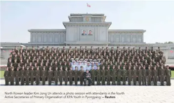  ?? — Reuters ?? North Korean leader Kim Jong Un attends a photo session with attendants in the fourth Active Secretarie­s of Primary Organizati­on of KPA Youth in Pyongyang.